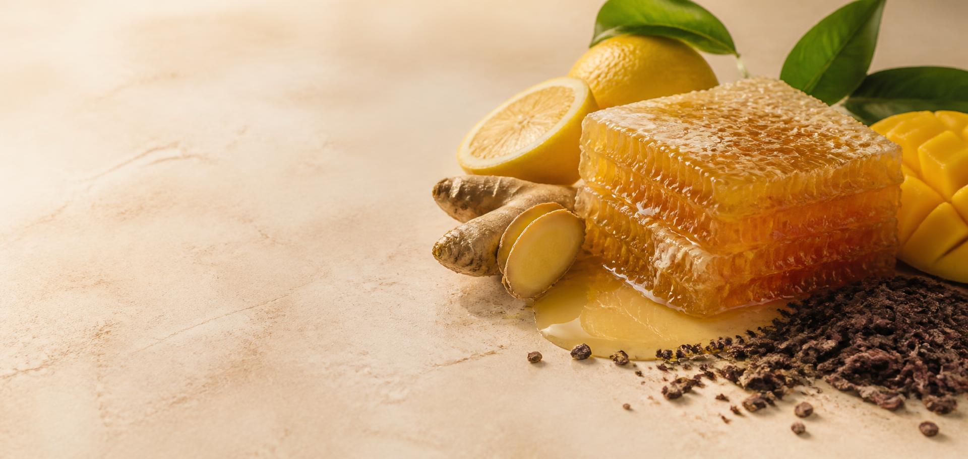 Raw honey with fresh lemon, ginger, mango and cocoa ingredients